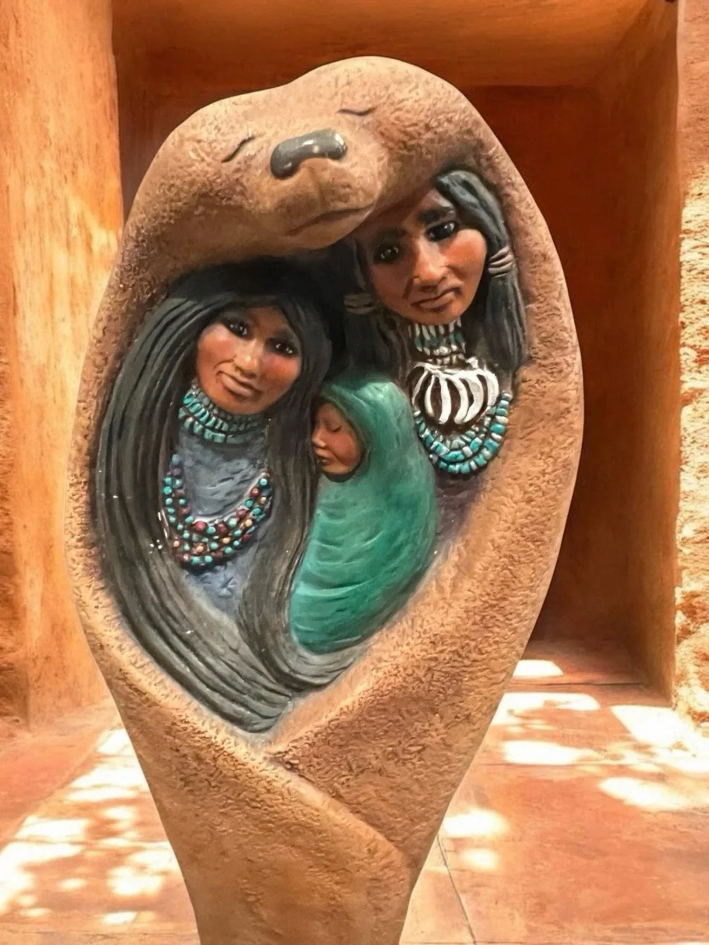 hand-painted ceramic bisque Native American family figurine sculpture.